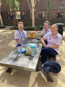 Staff enjoying their lunch in the new garden