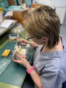 Orthodontic Technician Katie O’Dwyer with one of the traditional models