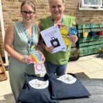 L-R) Safeguarding and Vulnerabilities Nurse Specialist for Dementia Zoe Chapman and Patient Experience Manager Sharon Kidd with the bags.