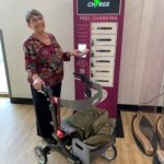 Shirley Churchill using the new phone charge bank at Lincoln County Hospital