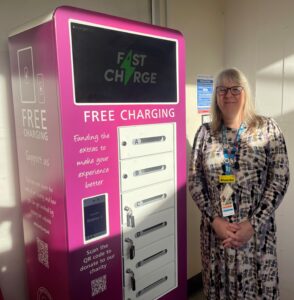 General Manager for Urgent and Emergency Care, Blanche Lentz, with the new phone charge bank at Pilgrim Hospital, Boston